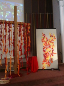 During the service people wrote on individual flames where they were hearing the Spirit call and what gifts they had been given to use in their calling. As part of the offering time they brought them forward to be assembled into the mural shown here.